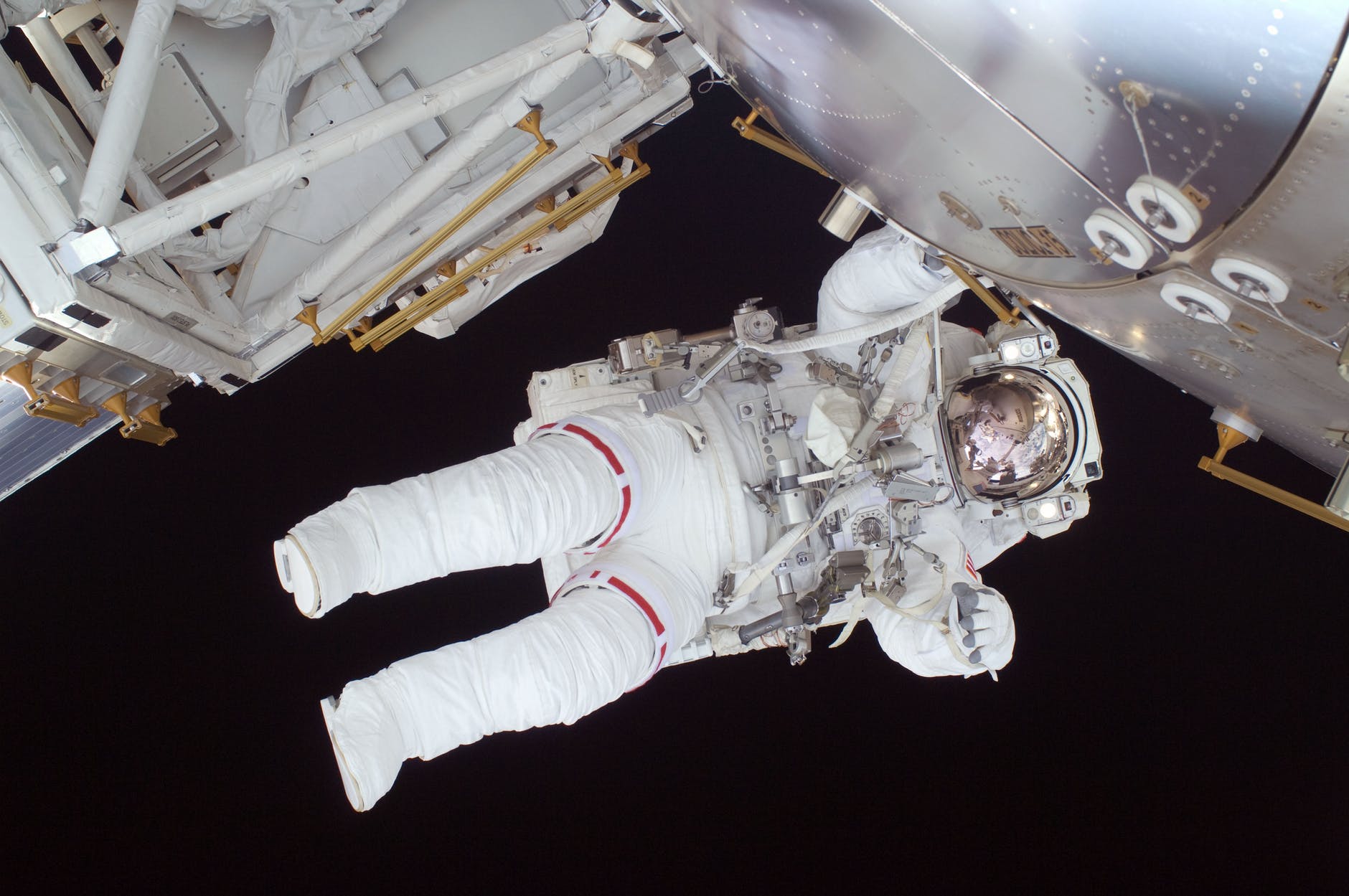 person in white astronaut suit